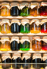 bright colorful jars of jam with different taste
