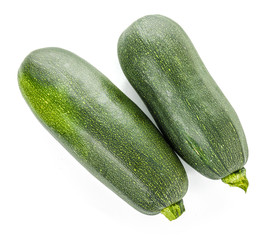 Fresh zucchini squashes on white background