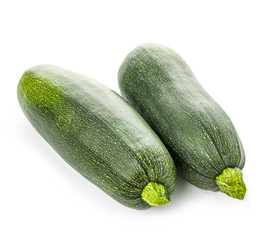 Fresh zucchini squashes on white background