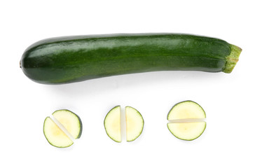 Fresh zucchini squash with pieces on white background