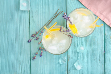 Glasses with lavender lemonade on wooden table