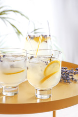 Glasses with lavender lemonade on table