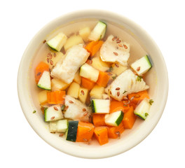 Bowl of tasty soup on white background