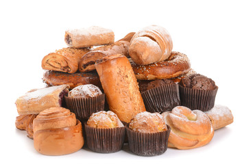Heap of tasty pastries on white background