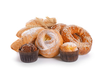 Heap of tasty pastries on white background
