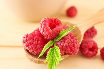 Spoon with fresh raspberries, closeup