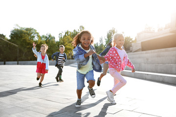 Group of running children outdoors