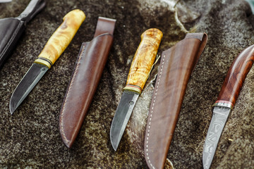 Ancient viking axe. knife and ax on the skin of a wolf,hand made damascus steel knives