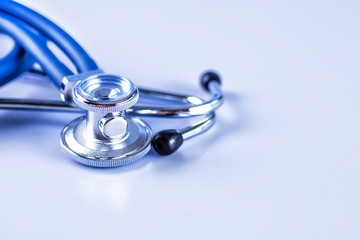 Medical concept image. Stethoscope on white background close up.A lot copy space around the product.Blue stethoscope.Healthcare.