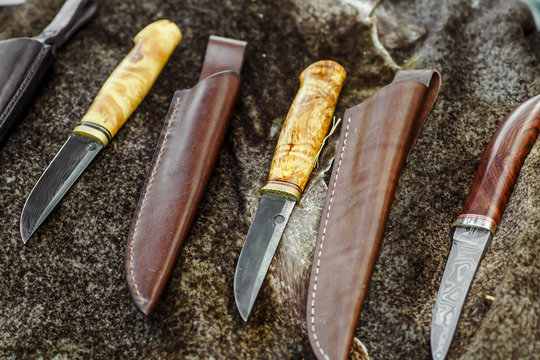 Ancient viking axe. knife and ax on the skin of a wolf,hand made damascus steel knives