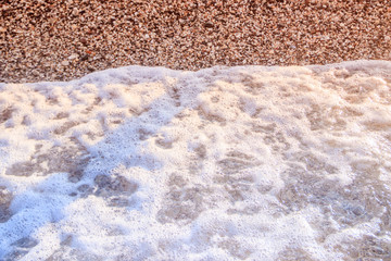 Fototapeta na wymiar Sea wave in the morning light. Sea wave and beach. Sea wave background. Crimea. Wave and pebble beach. Rest and travel to the sea.