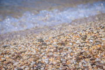 Sea wave in the morning light. Sea wave and beach. Sea wave background. Crimea. Wave and pebble beach. Rest and travel to the sea.