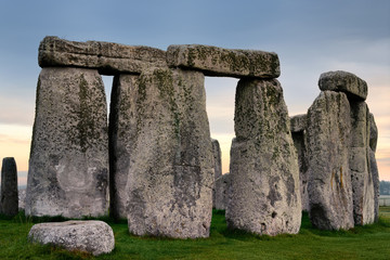 Lichen encrusted standing stones with lintels at Stonehenge prehistoric stone circle ruins on...