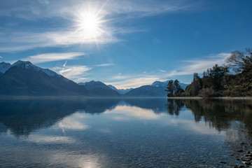 Beautiful Lake Wakatipu coastline under the slopes of the majestic Southern Alps