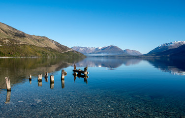 Ruins of an old wooden jetty in Lake Wakatipu near Glenorchy