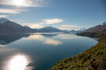 Beautiful Lake Wakatipu coastline under the slopes of the majestic Southern Alps