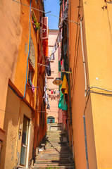 Fototapeta na wymiar Beautiful cozy streets of Genoa in summer day, Liguria, Italy