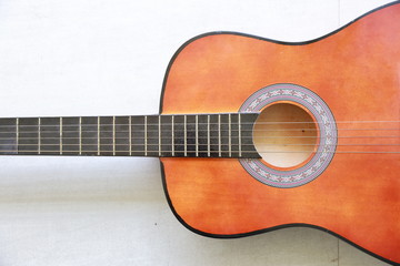 close up half acoustic guitar on white background with right free space