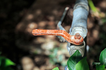 Close-up of an old gardening faucet