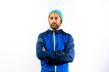 Man with winter sportswear and hat isolated on white.