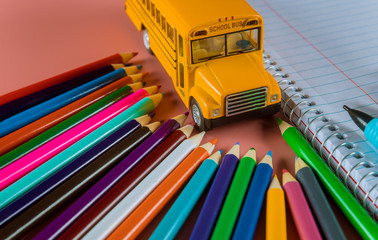 Back to school concept with bus and notebook ,pencil