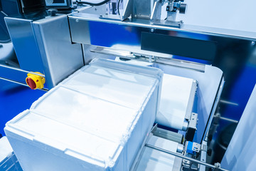 Automatic packing strapping tapes machine. Packing foam by the stretching. Product packaging in...