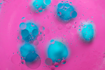 Abstract macro molecular pattern of colored oil bubbles on water. 