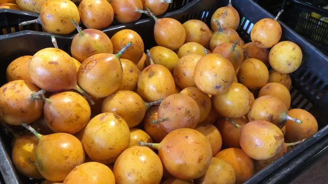 Granadilla exposed in a box in a supermarket in South America