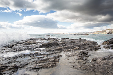 breaking waves on a stony beach