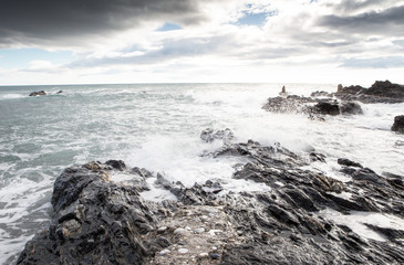 breaking waves on a stony beach
