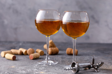 White wine in a glass. The concept of winemaking.Still life on a textural background.