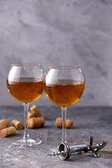 White wine in a glass. The concept of winemaking. Place under your text. Still life on a textural background.