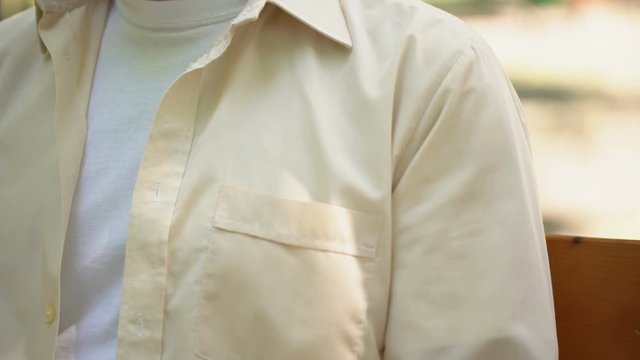 Male pensioner holding helping hands of volunteer, caring of visually impaired - Powered by Adobe