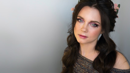 Fashion portrait of beautiful girl. Fantasy make-up and hairstyle. Gentle refined woman. Artificial...