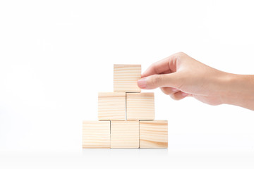 Hand build a pyramid from a wooden block