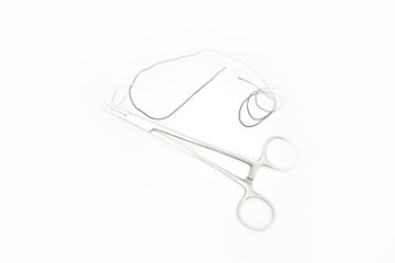 Forceps with curved suture needle isolated white background- Image