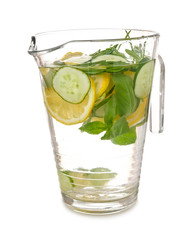 Jug of tasty infused water on white background