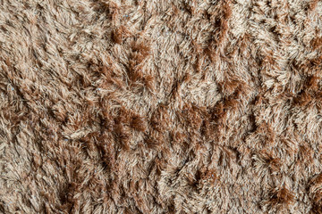 Brown fabric carpet with long pile texture