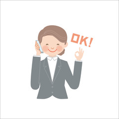 電話でOKを伝える女性（ビジネス）