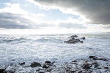 breaking waves on a stony beach