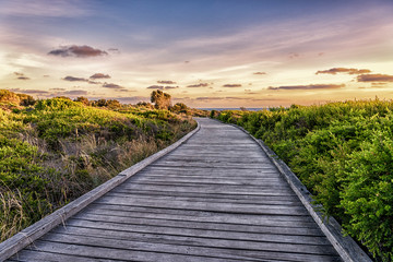 Wooden walkway to the beach at sunset, Great Ocean Road, Victoria, Australia