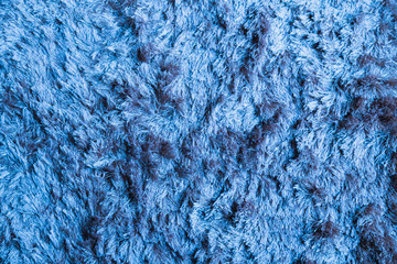 Blue fabric carpet with long pile texture