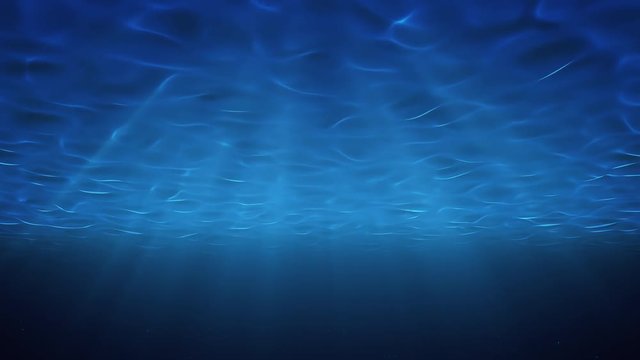 Rays of sunlight shining from above penetrate deep clear blue water. Sun light beams underwater. Small bubbles move up, under the water surface. Seamless Loop-able 3D Animation. 4K