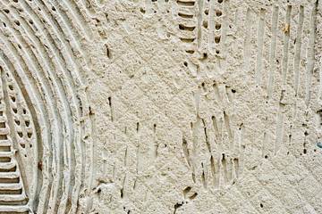 Texture of a concrete wall with cracks and scratches which can be used as a background