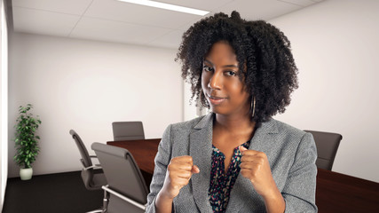 Black African American businesswoman in an office looking angry.  She is an owner or an executive...