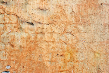 Texture of a concrete wall with cracks and scratches which can be used as a background