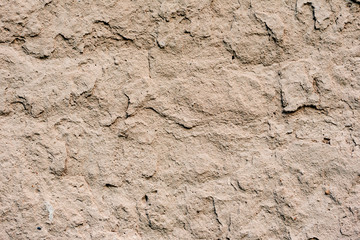 Texture of a concrete wall with cracks and scratches which can be used as a background
