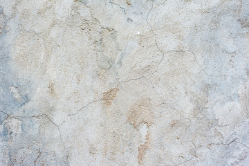 Texture of a concrete wall with cracks and scratches which can be used as a background