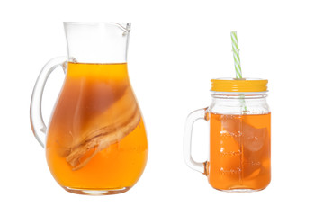 Homemade fermented drink Kombucha in a glass jug and jar. Isolated on white background