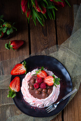 light pavlova with fresh fruits and chocolate